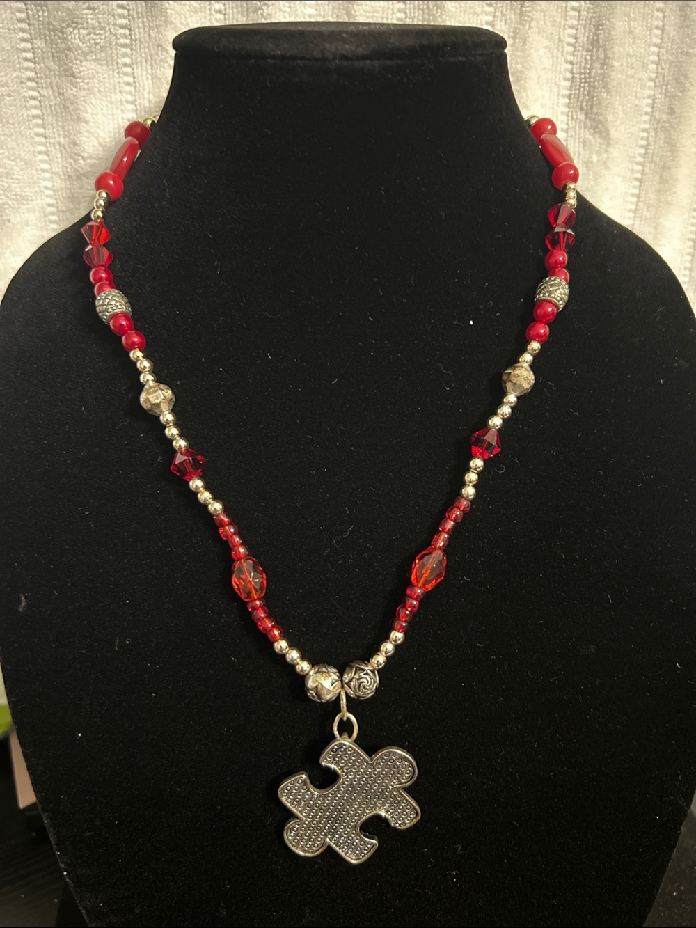 Red Beaded Necklace with Silver Puzzle Pendant